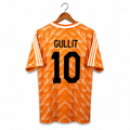Orange sports jersey with 'Gullit' and number '10' on a hanger against a white background